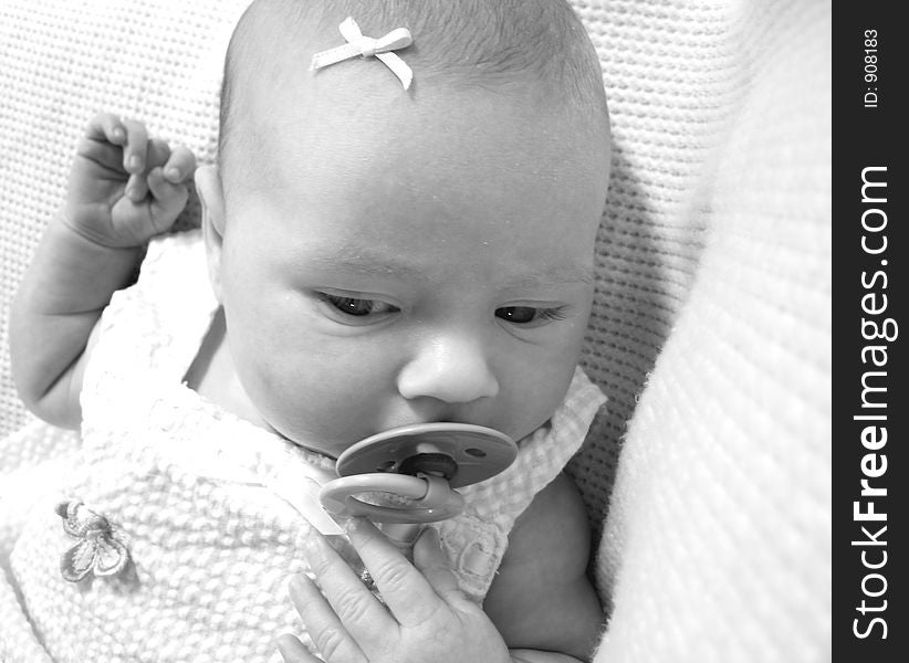 Newborn girl with her pacifier. Newborn girl with her pacifier