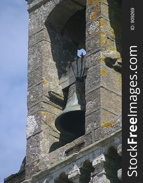 Old church bell in a clock tower of a very old French church