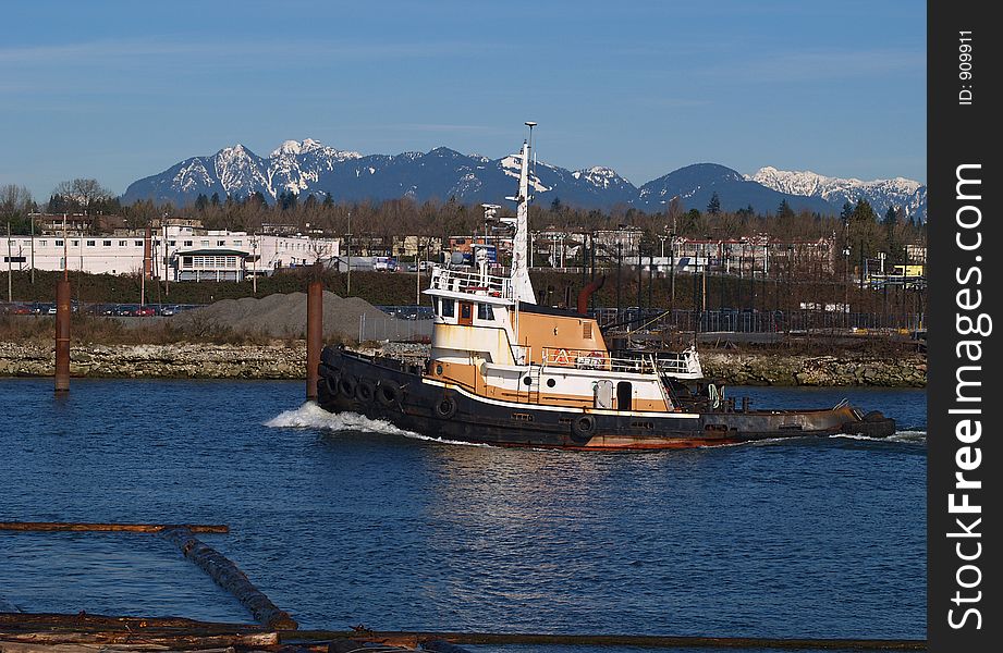 Tug moving up inner harbour in Richmond BC