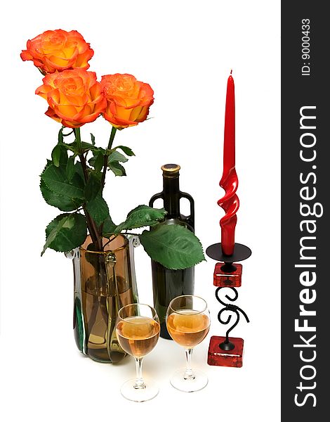 Bottle of wine, glasses, red candle and bouquet of orange roses isolated on wite. Bottle of wine, glasses, red candle and bouquet of orange roses isolated on wite