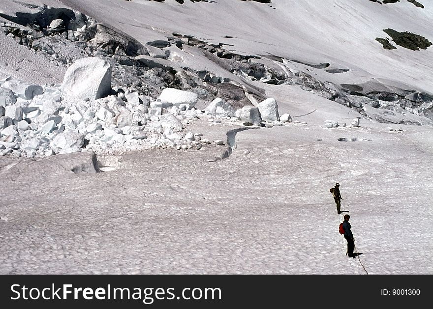 Climbers traversing crevassed glacier, Whatcom Peak, North Cascades, Washington, Pacific Northwest