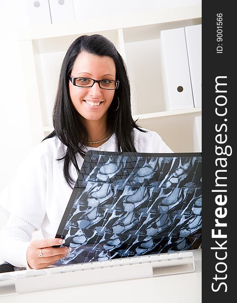 Beautiful young doctor in doctor's office