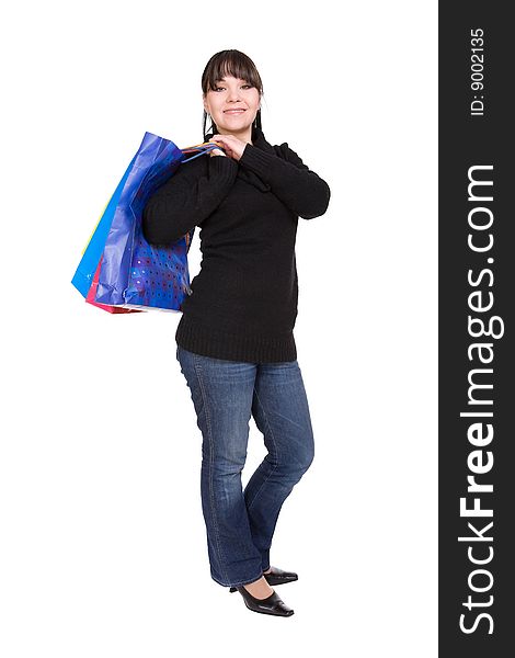 Happy brunette woman with shoping bags. over white background. Happy brunette woman with shoping bags. over white background