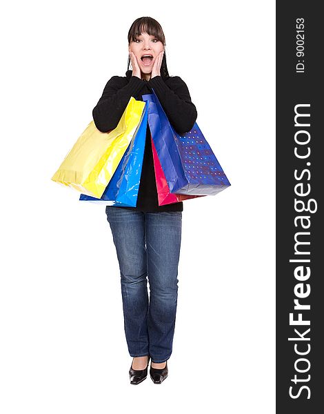 Happy brunette woman with shoping bags. over white background. Happy brunette woman with shoping bags. over white background