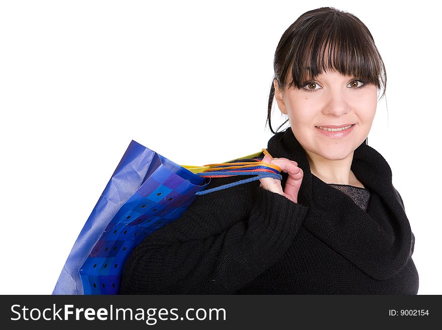 Happy brunette woman with shoping bags. over white background. Happy brunette woman with shoping bags. over white background