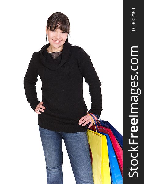 Happy brunette woman with shoping bags. over white background. Happy brunette woman with shoping bags. over white background