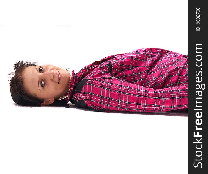 Portrait of a young woman wearing a pink shirt on the floor!. Portrait of a young woman wearing a pink shirt on the floor!