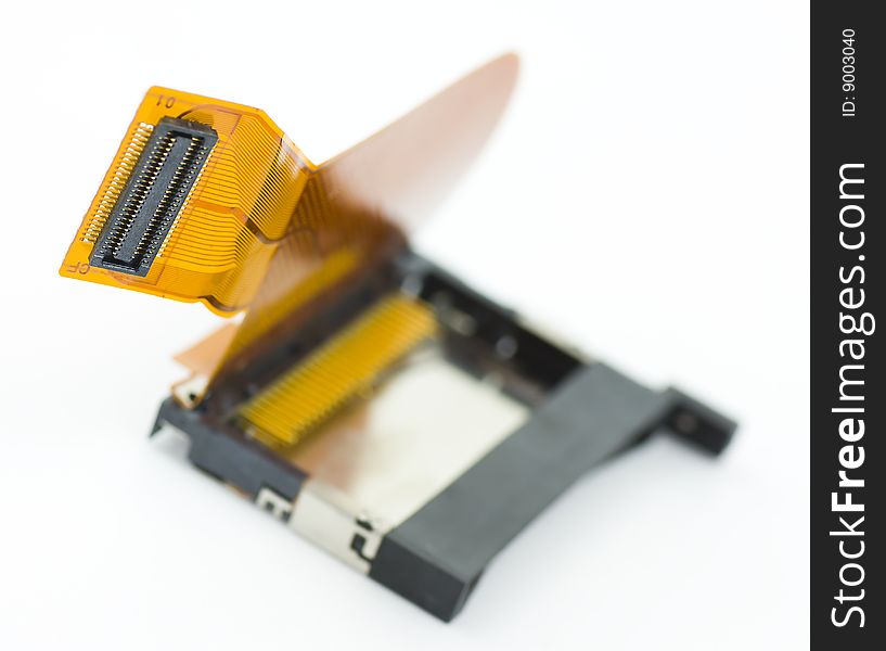 Card reader (compact-flash) module disassembled from photo compact camera isolated on white background in shallow dof. Card reader (compact-flash) module disassembled from photo compact camera isolated on white background in shallow dof