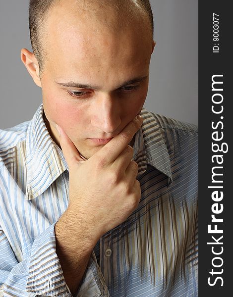 Pensive young man in shirt