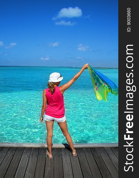 Woman standing on the beach with pareo. Woman standing on the beach with pareo