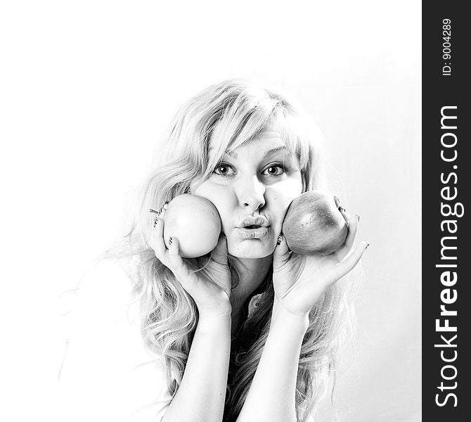 Portrait of a young blonde girl with apples in the white background. Portrait of a young blonde girl with apples in the white background