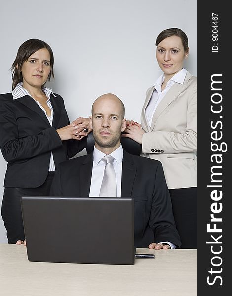 Young businessteam of three persons with a bossy executive