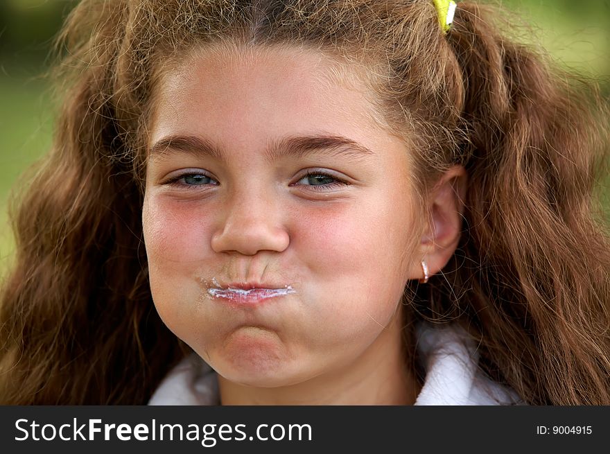 Funny little cute girl brushing teeth outdoors. Funny little cute girl brushing teeth outdoors