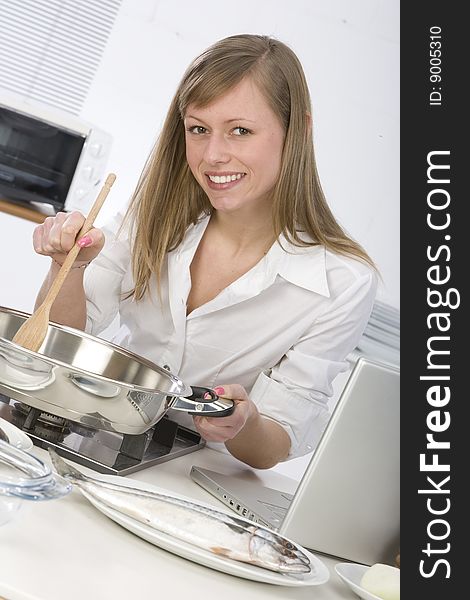 Woman in the kitchen with computer