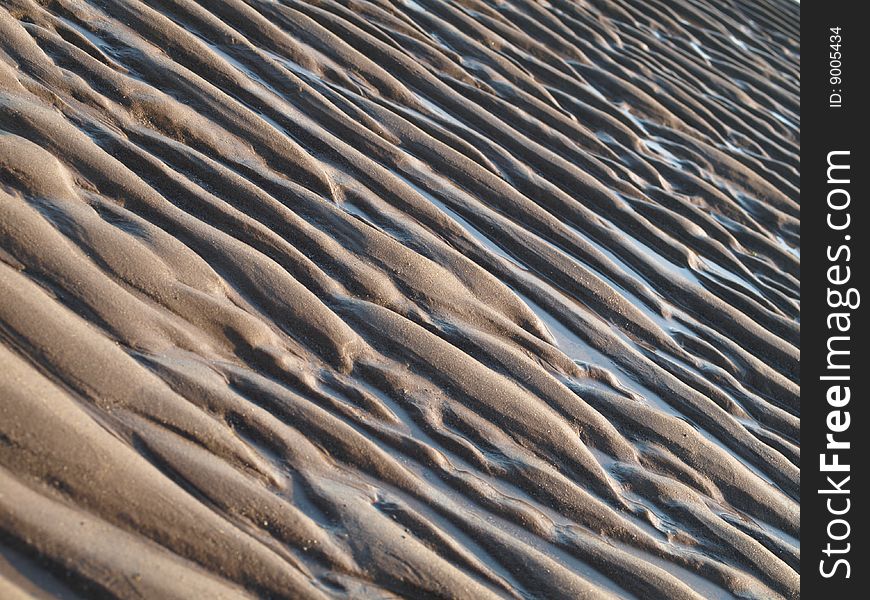 Sand pattern background after an outflow. Sand pattern background after an outflow.