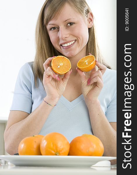Girl In The Kitchen With Juicy Orange