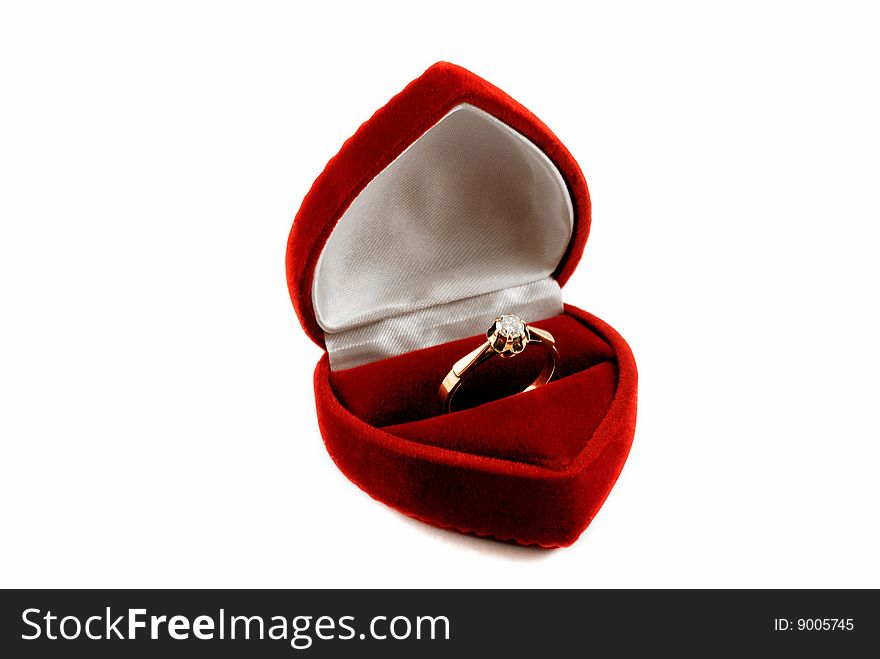 Diamond ring in fancy box isolated over black background.