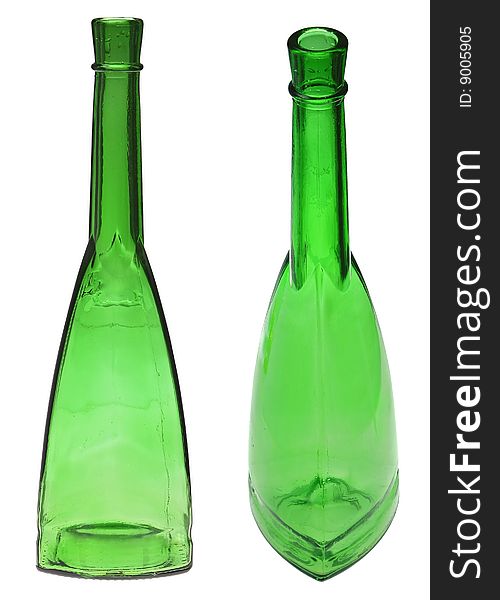 Green glass bottles on the white. Green glass bottles on the white