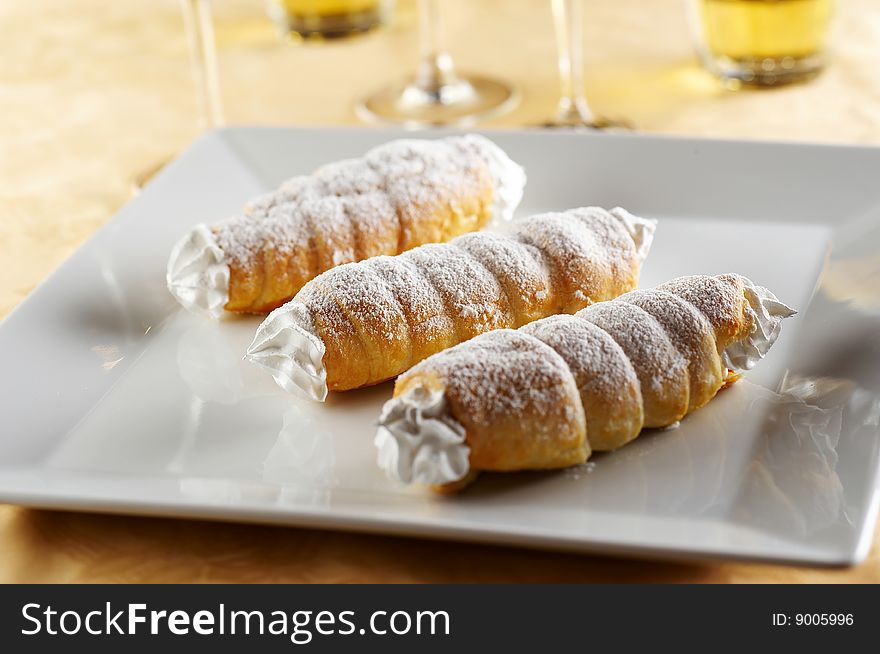 Three rolls filled with sweet cream. Three rolls filled with sweet cream