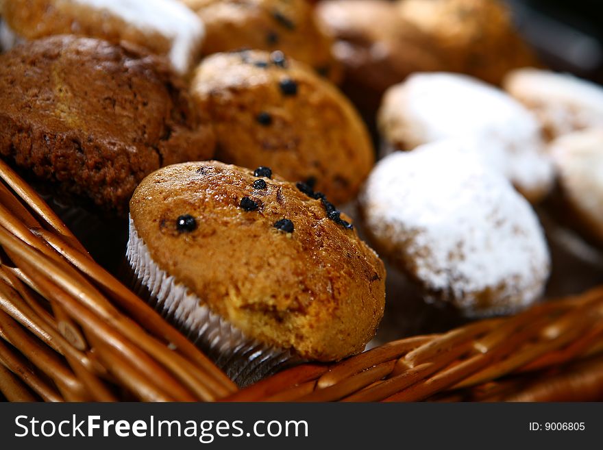 Delicious cakes in basket clode up