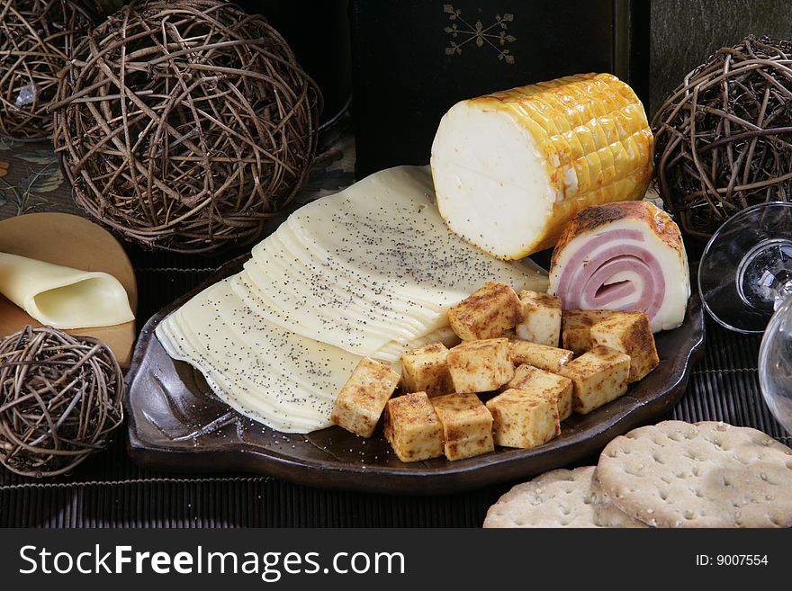 cheese and spices on dark background