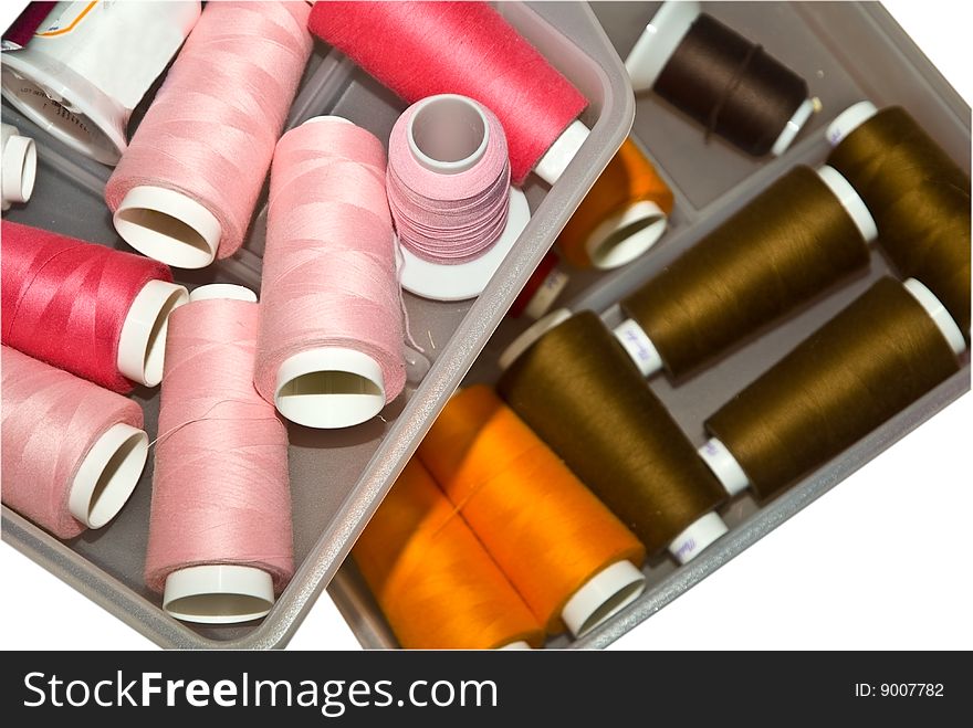 Drawers holding colorful embroidery threads used on materials of different types. Drawers holding colorful embroidery threads used on materials of different types.