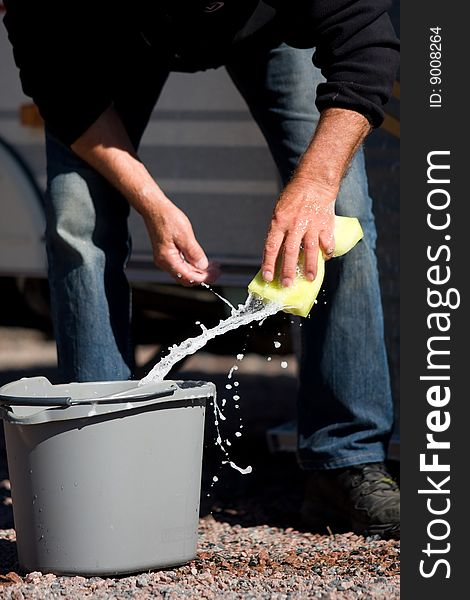 Man washing outside on a sunny day