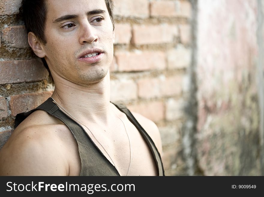 A young male model from Brazil in outdoors photograph. A young male model from Brazil in outdoors photograph.