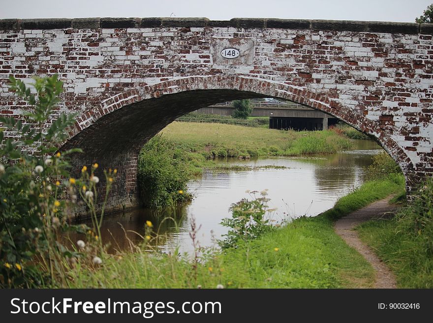 Known locally as the White Bridge. In the background is Bridge 147a carrying the M6 over the Trent & Mersey Canal. Known locally as the White Bridge. In the background is Bridge 147a carrying the M6 over the Trent & Mersey Canal.
