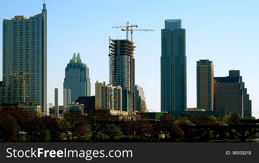 A fairly tight view of downtown from Zilker. This shot actually contains the three tallest buildings in Austin., with the old Austin Power Plant visible in front of downtown. A fairly tight view of downtown from Zilker. This shot actually contains the three tallest buildings in Austin., with the old Austin Power Plant visible in front of downtown.