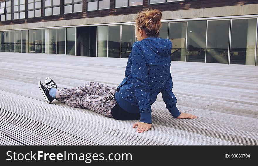 Trendy Woman Relaxing On Decking