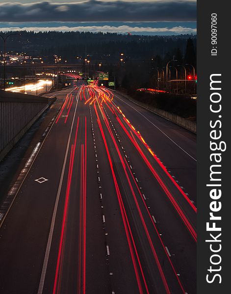 A long exposure of a highway with light trails from car lights. A long exposure of a highway with light trails from car lights.