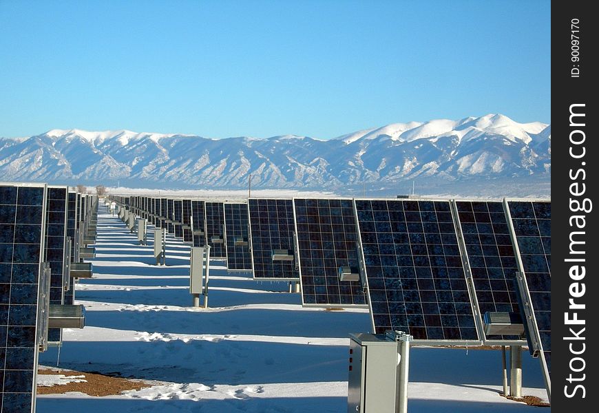 Silver and Black Solar Panels on Snow Covered Ground