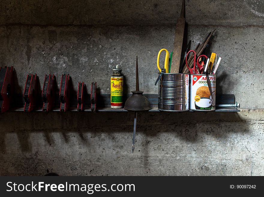 A shelf with tools in a garage. A shelf with tools in a garage.
