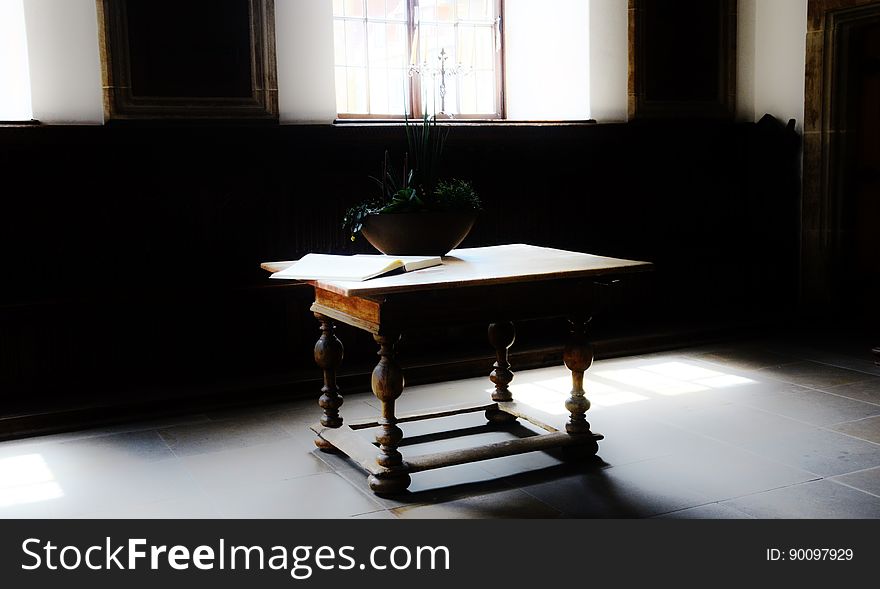 An antique table in a room.