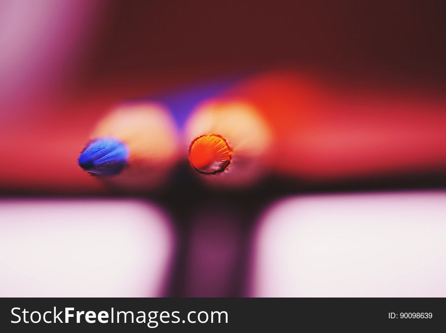 Red and blue color pencils with focus on the tips.