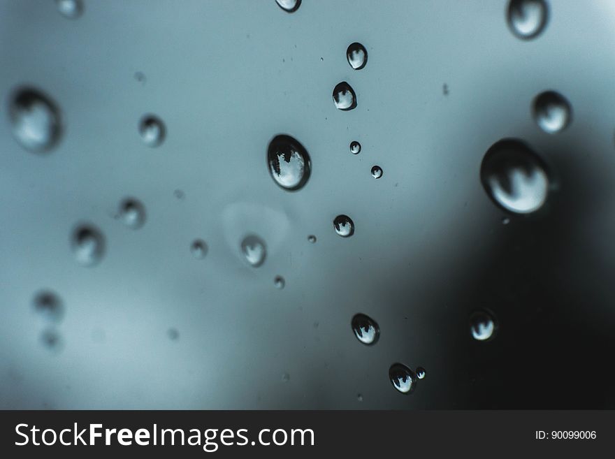 A glass with drops of water on the surface. A glass with drops of water on the surface.
