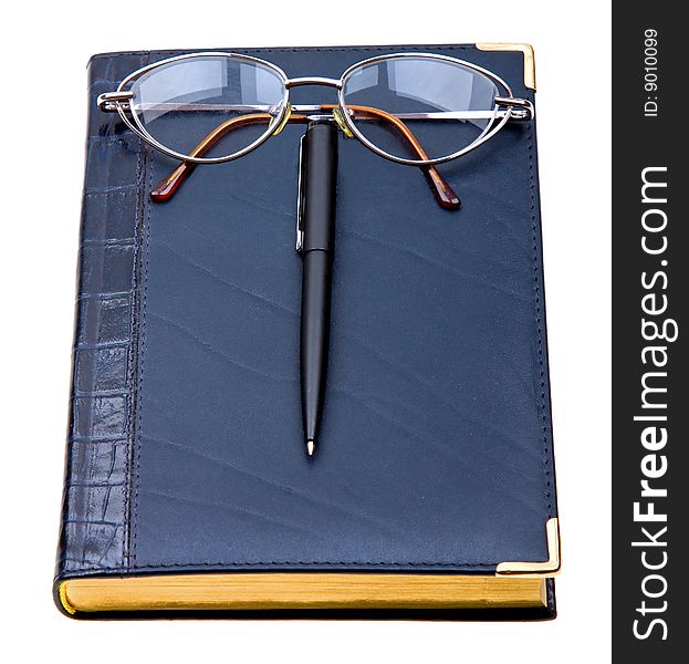 Daily planner with glasses and pen isolated on white background