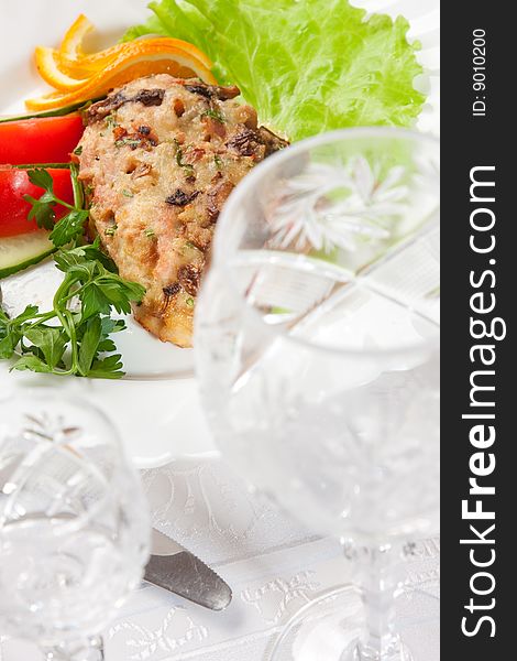 Backed meat with vegetable salad with goblet. Backed meat with vegetable salad with goblet