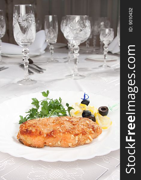 Tasty chop served in white table with goblets