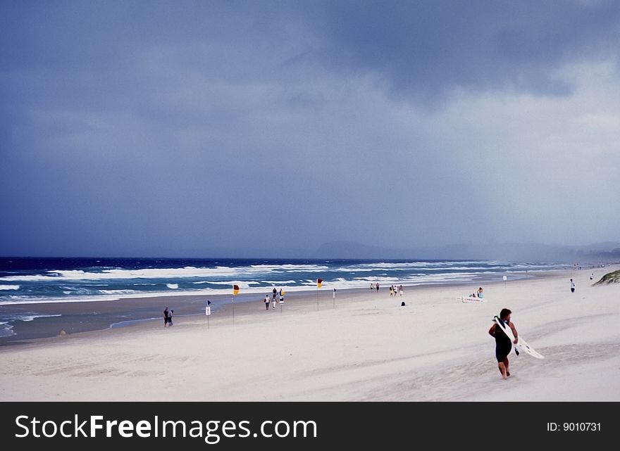 Surfer and people on a beach in australia