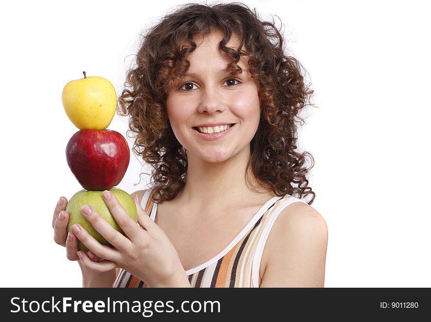 Young smiling woman with three apples. Attractive girl is holding the pyramid of apples. Isolated over white. Young smiling woman with three apples. Attractive girl is holding the pyramid of apples. Isolated over white.