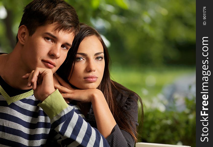 Young, happy couple on a walk in the park. Young, happy couple on a walk in the park