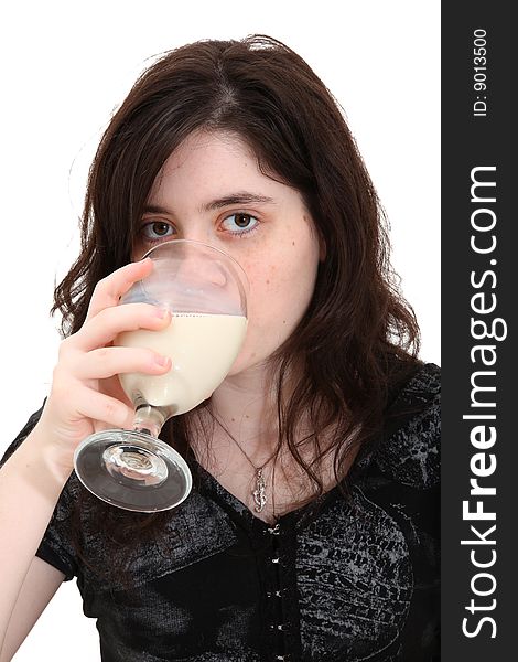 Beautiful teen girl drinking glass of soymilk (soy milk) over white background. Beautiful teen girl drinking glass of soymilk (soy milk) over white background.