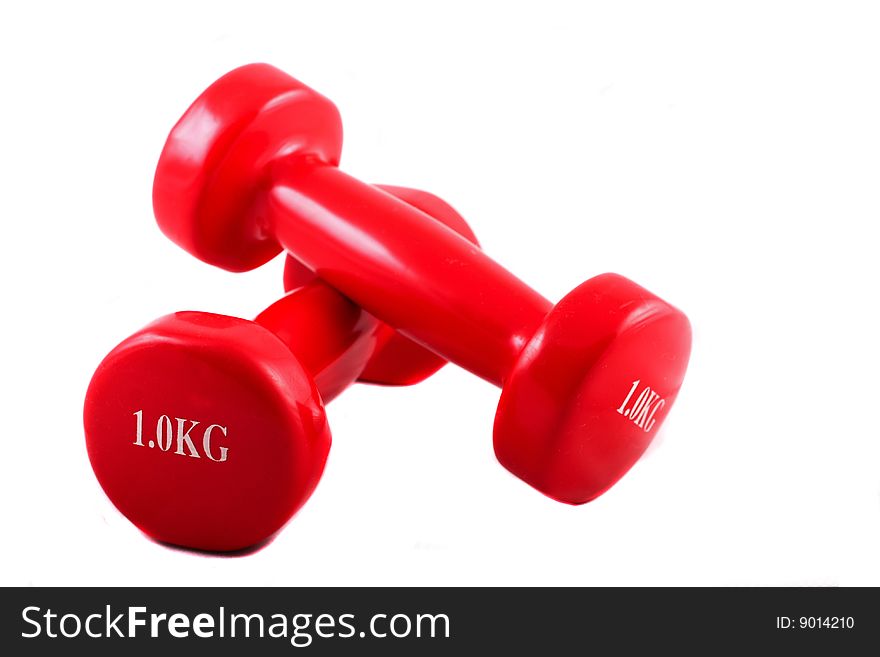 Two dumbbells against a white background. Two dumbbells against a white background