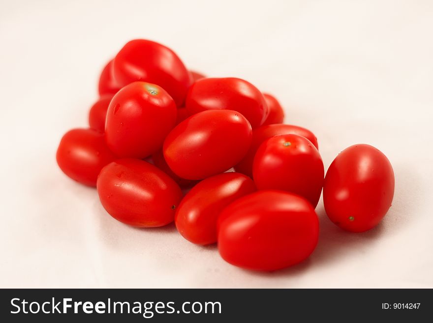 A close-up shot of a bunch of cherry tomatoes.