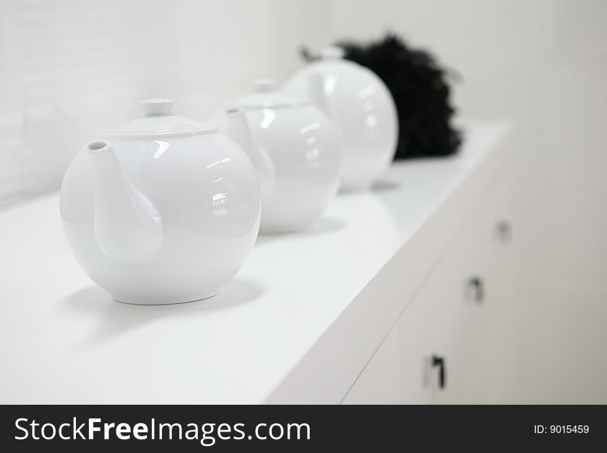 White tea pots on white background