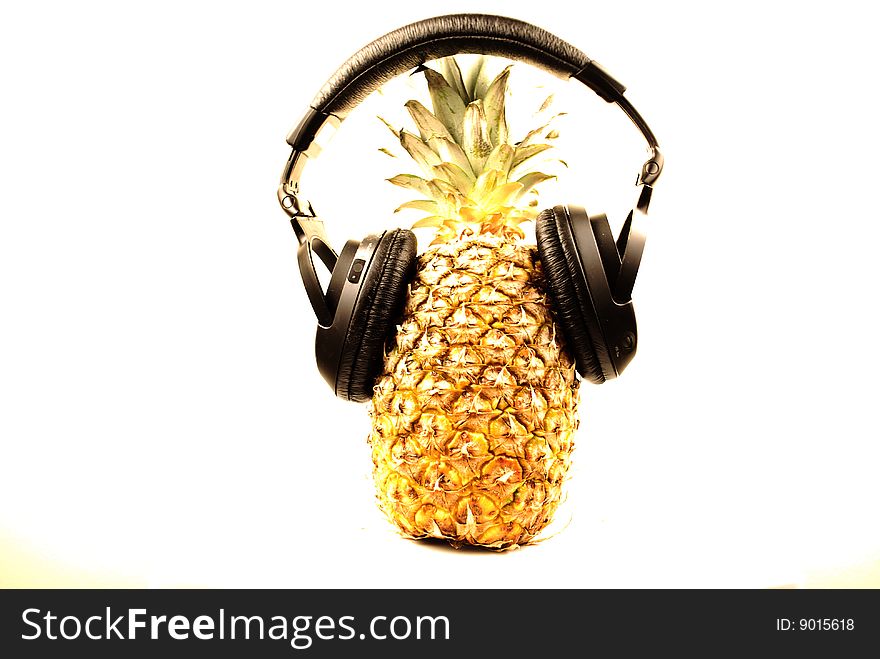 Closeup isolated pineapple with headphone. Closeup isolated pineapple with headphone