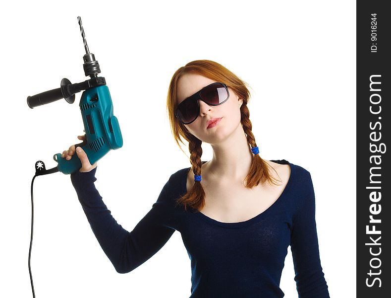 Pretty girl with a drill, isolated on white background