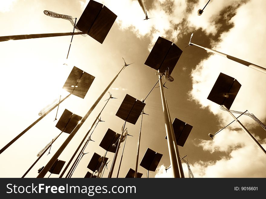 Sepia toned image of wind turbines and solar panels. Sepia toned image of wind turbines and solar panels